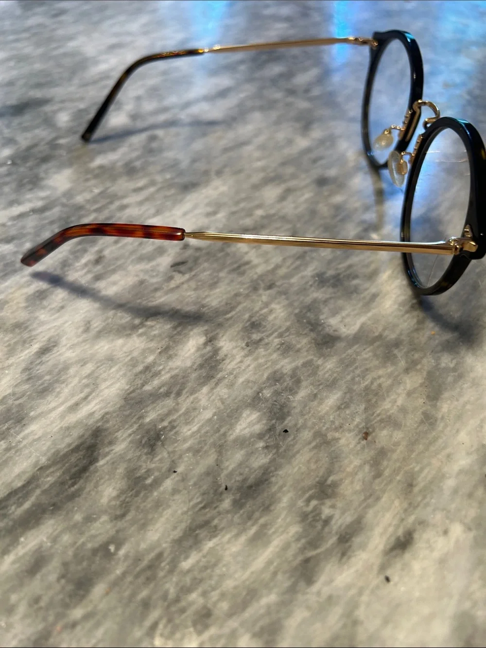 Warby Parker Gold and Tortoiseshell Eyeglass Temple Model is Jayla